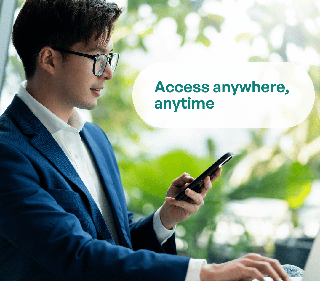 Business professional in suit using smartphone with text overlay: Access anywhere, anytime.